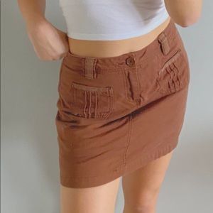 terracotta colored skirt with frilly pockets